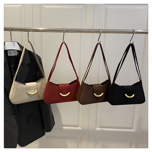 Detailed display of four vintage square shoulder bags with elegant metal hardware