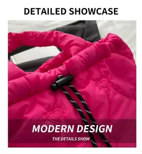 Detail of pink quilted tote bag with heart patterns and woven drawstring closure