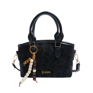 Vintage black leopard embossed bucket bag with wooden bead charm and crossbody strap