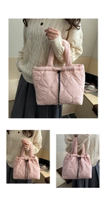 Detail of pink quilted tote bag with heart stitching and polka dot drawstring closure