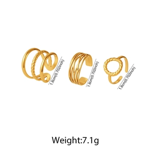 Detailed view of three gold vintage geometric ear cuffs with cross lines and textured bands