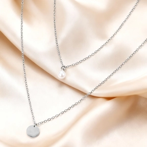 Double-layered stainless steel necklace with pearl and round disk pendant on satin