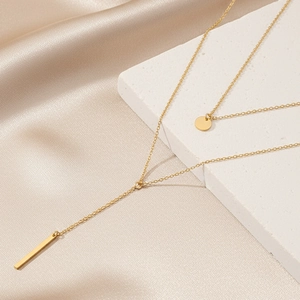 Double layered gold stainless steel necklace with round and rectangle pendants on satin