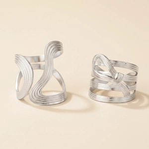 Modern set of two silver-colored adjustable rings with brushed metal texture finishes