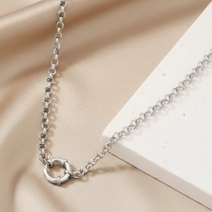 Chic stainless steel chain necklace with sailor clasp on elegant satin background