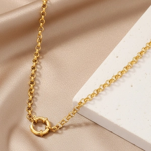 Gold stainless steel chunky chain necklace featuring a vintage sailor clasp on silk