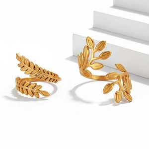 Macro shot of 18K gold plated leaf rings with elegant matte brushed metal texture