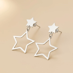 Minimalist silver stainless steel star drop earrings featuring hollow star pendant