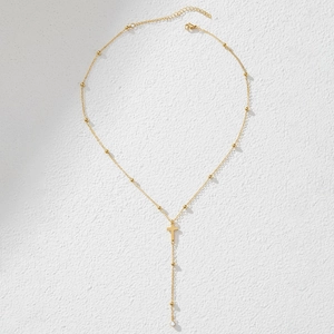 Golden Y-shaped beaded cross necklace with sparkling cubic zirconia tassel pendant