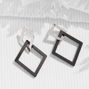 Irregular geometric metal tassel earrings in silver and black matte finish