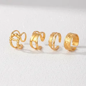Set of four gold stainless steel geometric open rings with minimalist hollow out design