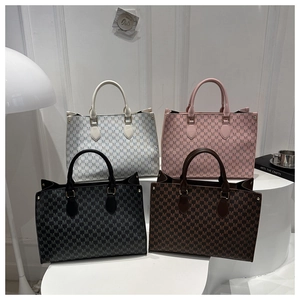 Detailed display of four vintage monogram tote bags in black, white, pink and brown