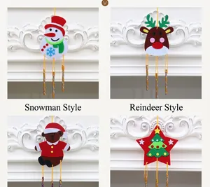 Macro view of Christmas felt wind chimes featuring snowman and reindeer DIY craft designs
