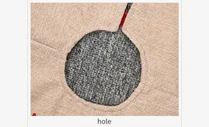 Close-up of burlap Christmas tree skirt showing woven linen texture and center cut