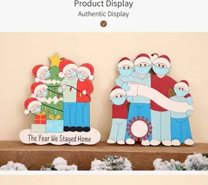 Detailed view of commemorative wooden Christmas ornaments showing masked characters on a table