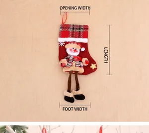Close-up of a burlap Christmas stocking featuring a 3D snowman with long dangling legs