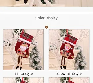 Detail of burlap Christmas stockings with 3D Santa and Snowman plush doll hanging legs