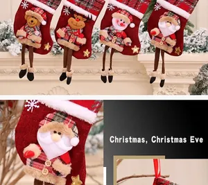 Detail of Christmas stocking hangers featuring 3D Santa, snowman, elk, and bear doll designs