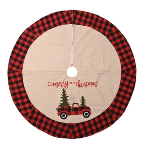 Round Christmas tree skirt with red plaid border and classic red truck design