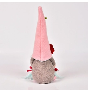 Detail of pink pointed hat gnome with felt texture and red flower on white background