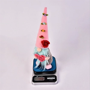 Mother's Day gnome plush with floral pink hat holding an 'I Love You Mom' red heart