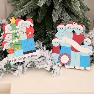 Wooden pandemic Christmas tree ornaments featuring masked family and stay home message