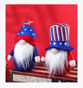 Detailed view of patriotic 4th of July gnomes with red white and blue hats on wooden box