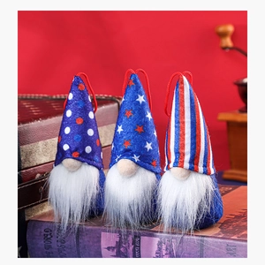 Close-up of three patriotic American Independence Day gnomes with stars and stripes patterns
