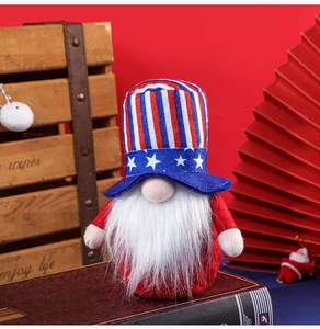 Patriotic gnome doll with Stars and Stripes hat and long white beard on wooden box