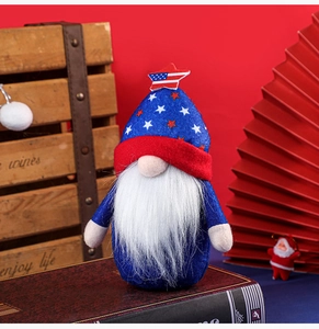 Detailed view of patriotic 4th of July gnome plush on a vintage book with stars and stripes
