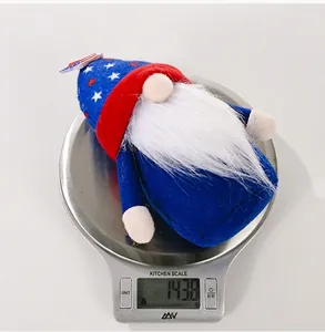 Close-up of patriotic gnome plush showing accurate product weight of 143.8g on a scale