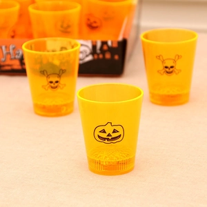 Halloween orange glowing cups with black pumpkin and skull patterns for festive party decor