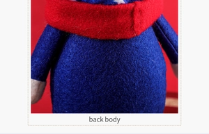 Macro shot of blue fabric back body texture on a patriotic gnome doll with red scarf