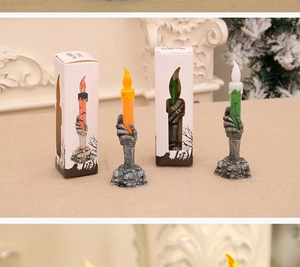 Detailed view of Halloween LED candle lights with skeleton hand bases and gift packaging