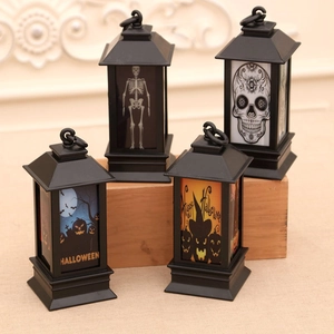 Set di quattro lanterne LED per Halloween con disegni di zucca, teschio e mago in nero