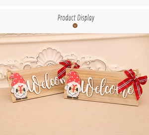 Detail of wooden Christmas welcome sign with gnome, buffalo plaid bow and rope hanger