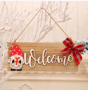 Detail of wooden Christmas welcome sign with gnome pattern and red buffalo check bow