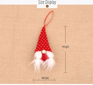 Detail view of a Christmas gnome ornament with red polka dot hat and white beard