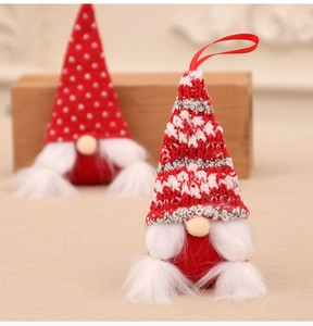 Detail of Christmas gnomes with knitted hats and faux fur beards for holiday decor
