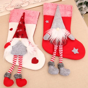 Set of 2 plush Christmas gnome stockings with long legs in red and white festive colors