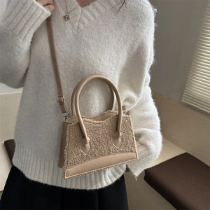 Women's fleece patchwork handbag with adjustable shoulder strap and gold hardware