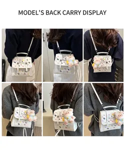 Detail shots of white backpack with letter prints and pink bear keychain