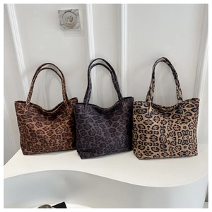 Detailed comparison of three leopard print canvas tote bags in different color patterns