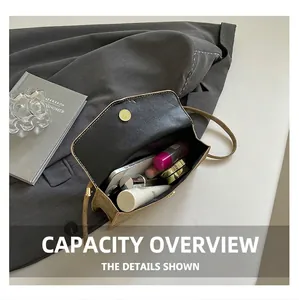 Internal capacity of the vintage brown crossbody bag showing space for phone and makeup