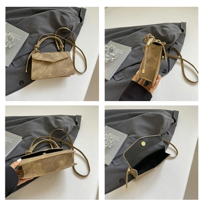 Detail views of vintage brown crossbody bag with V-shaped flap and gold hardware