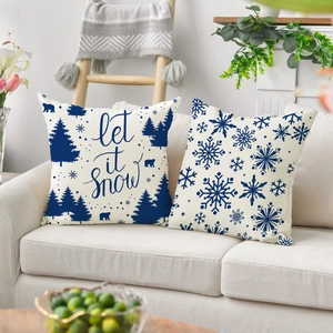 Christmas cushion covers set of 2 with polar bear and snowflake patterns on sofa