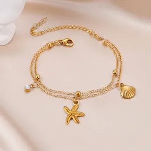 Gold double-layered stainless steel bracelet with starfish, seashell and zircon charms