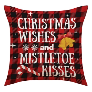 Detail of red and black buffalo plaid Christmas pillow cover with holiday wishes text
