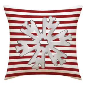 Detail of square Christmas pillowcase with red white stripes and silver snowflake pattern