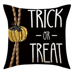 Detail of Trick or Treat Halloween pillowcase with gold glitter pumpkin on linen texture
